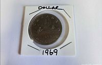 Reverse side of 1969 Canada dollar in 2×2 flip