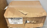 Closed cardboard case showing shipping label WCD-11196