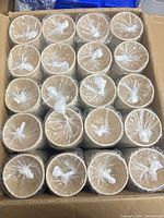 Open box showing multiple sleeves of sealed bamboo cups