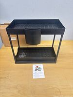Front view of assembled two-tier caddy on table