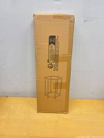 Front view of sealed retail box showing line drawing of hexagonal drying rack