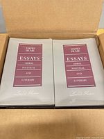 Open box showing multiple sealed copies of David Hume Essays: Moral, Political, and Literary