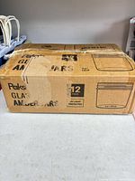 Factory-sealed box marked Paksh Glass Amber Jars 12 pack