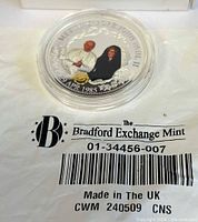 Coin in protective capsule on Bradford Exchange Mint packaging