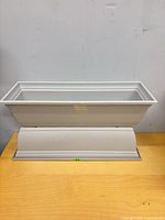 Two stacked light grey plastic rectangular planter boxes with trays, full view