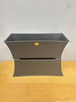 Front view of one planter showing tapered shape and texture