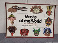Front cover with illustrated mask designs and title
