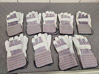 All nine pairs of new work gloves arranged together