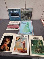 All seven books displayed together
