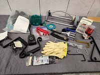 overview of mixed home and garden supplies on table