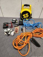 Overview of entire lot showing cords, testers, adapters