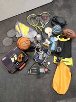 Overview of all sporting goods laid out on floor