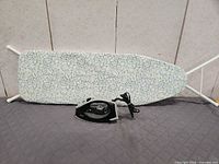 Full view of ironing board and iron