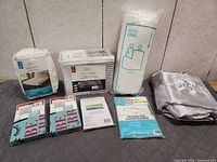 All seven sealed bedding items displayed