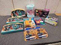 Group shot of all packaged toys including three Elena of Avalor sets, nap mat, craft kit, robot sets and others
