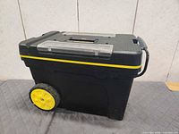 Side view of rolling toolbox showing wheels and body