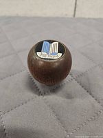 Top view showing Triumph badge with blue/white stripes and lettering