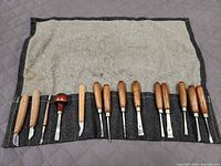 full set of chisels and gouges laid out in roll