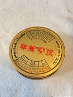 top view showing calendar graphics and gold finish