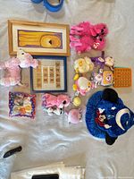 Grouping of plush toys, wall decor, Pop It and small toys