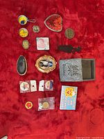 All 16 assorted items laid out on red background