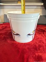Side view showing Pennywise eyes graphic and tape measure indicating height