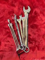 Group of combination wrenches showing quantity and condition