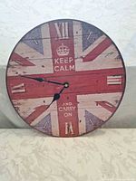 Front view of round Union Jack wall clock showing overall design and condition