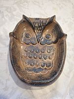 Top view of owl-shaped ceramic dish showing relief details and glaze