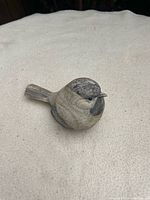 Top view of beige and brown resin bird figurine
