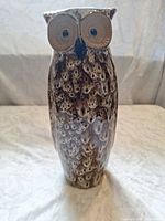 Front view of ceramic owl vase