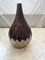 Front view showing faceted texture and gradient finish
