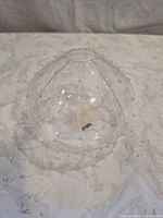 Clear glass sphere vase front view showing ribbing and raised dots