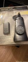 Front of sealed package showing timer and remote