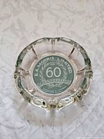 Top view of ashtray showing full commemorative logo
