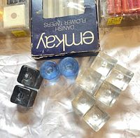 Emkay box with assorted clear, blue, black glass candle holders