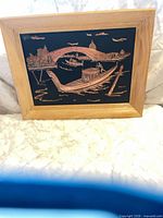 Full view of framed copper relief wall art