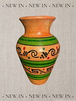 Front view of vase showing overall shape and painted design