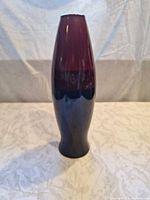 Full frontal view of tall two-tone ceramic vase