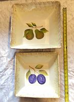Top view of both bowls showing fruit motifs and tape measure for size