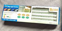 Front of retail box displaying four LED bars and key specs
