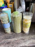 Front view of pillar candle and two tubes of wax melts