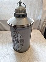 Full view of lantern showing filigree panels and overall shape