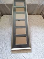 Front view of silver metal collage frame showing six 4×6 openings