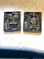 Both chalkware plaques front view
