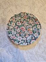 Front of first plate showing full floral pattern