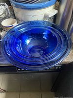 Top view of the three nested cobalt blue Pyrex bowls