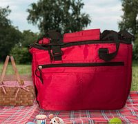 Front view showing exterior zip pocket, handles, shoulder strap