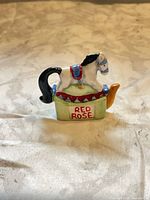 Front view of porcelain carousel horse figurine on base