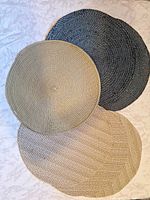 Three placemats showing colors and weave